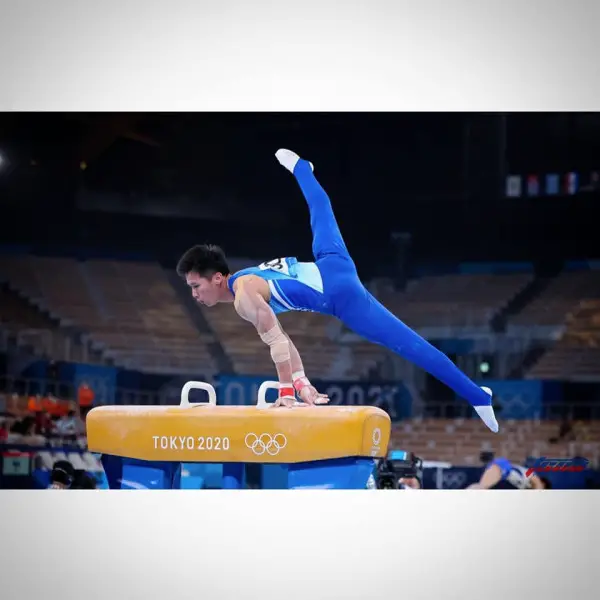 Lee Chih-kai winning a silver medal at Tokyo 2020.  Taiwan's first medal in gymnasatics.