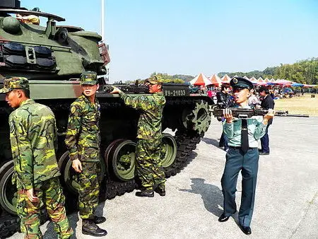 R.O.C. Army soldiers removing the machine guns from a CM-12 Tank.  Taiwan has maintained a policy of conscription for all qualified males of military age(18) since 1951