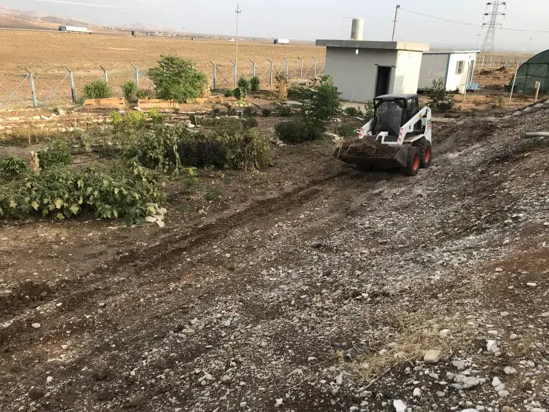  Taking advantage of the local talent to sculpt the landscape with a bobcat.  This operator was an artist with his machine.  The mountains to Iran can be seen in the background